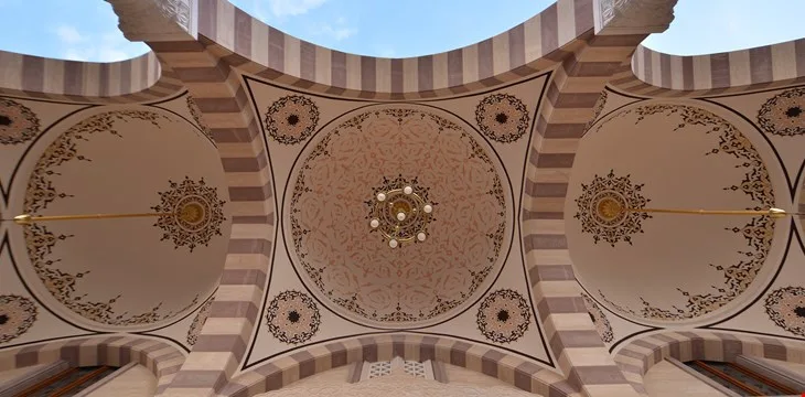 Geometric hand-drawn patterns on the portico ceiling