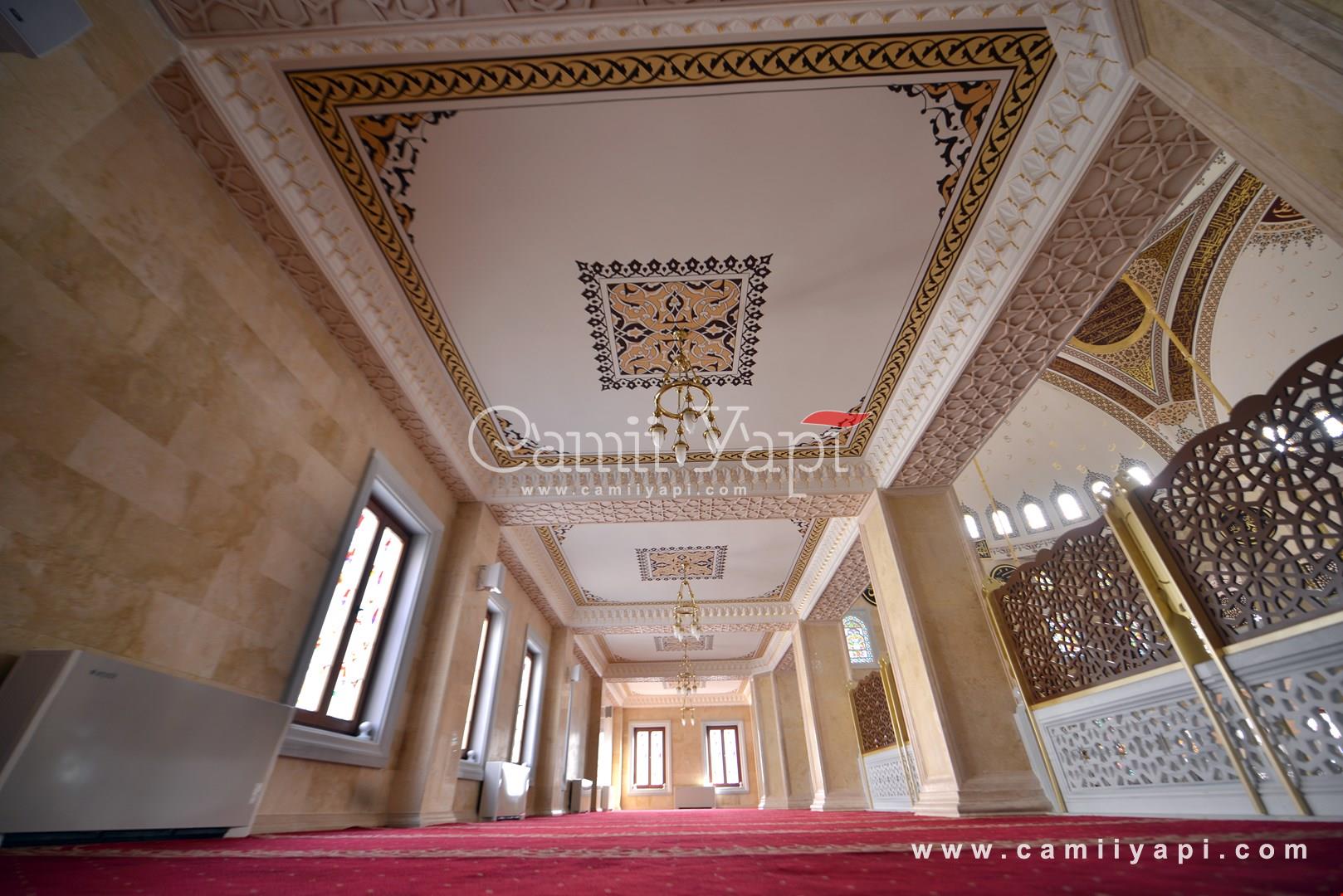 Mosque corridor with ceiling decorations and columns
