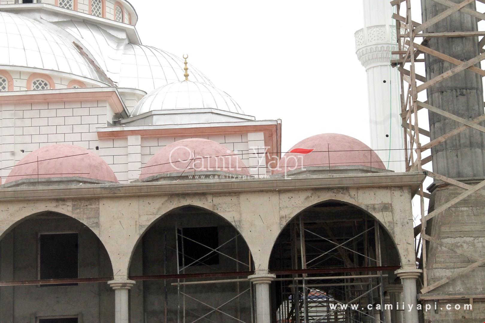 Mosque portico and dome facade with scaffolding